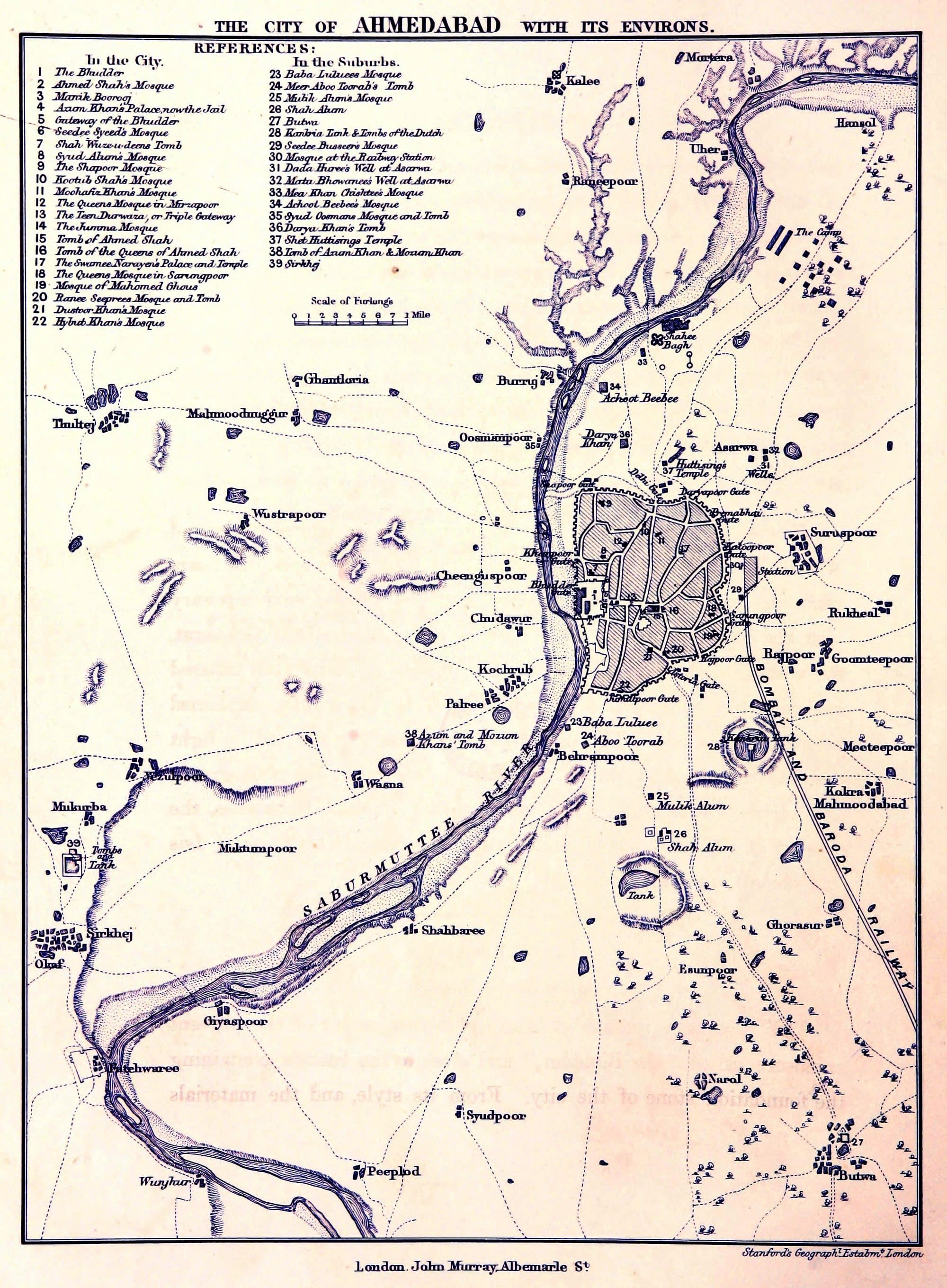 A printed map titled 'The City of Ahmedabad with its Environs'. The walled city, hatched, sits on the east bank of the 'Saburmuttee River', which is drawn as braided channels across a wide bed. A numbered key lists mosques, tombs and wells; Kankria Tank is marked to the south-east of the city and Dada Huree's Well at Asarwa to the north-east.
